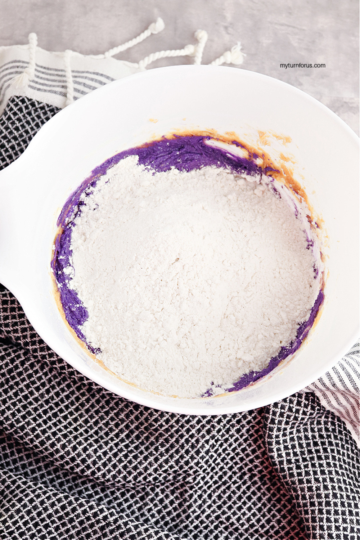 Adding flour to the cookie dough