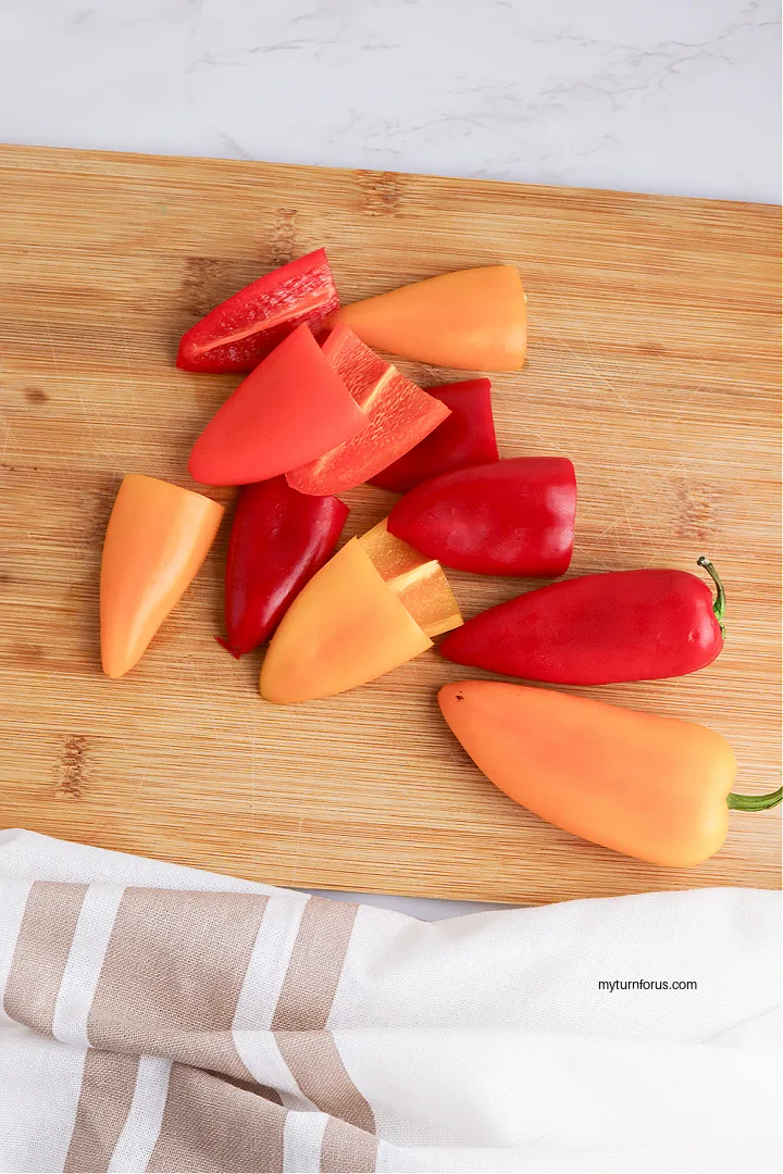 Sliced orange and red mini peppers